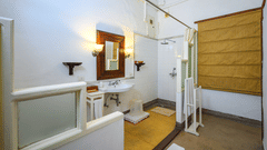 An overview of the bathroom showcasing the sink and shower area inside Maharani Bakhtawar Kaur room - The Baradari Palace