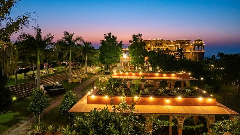 Night view of Tijara Fort-Palace - 19th Century, Alwar with multiple hued sky in the background.
