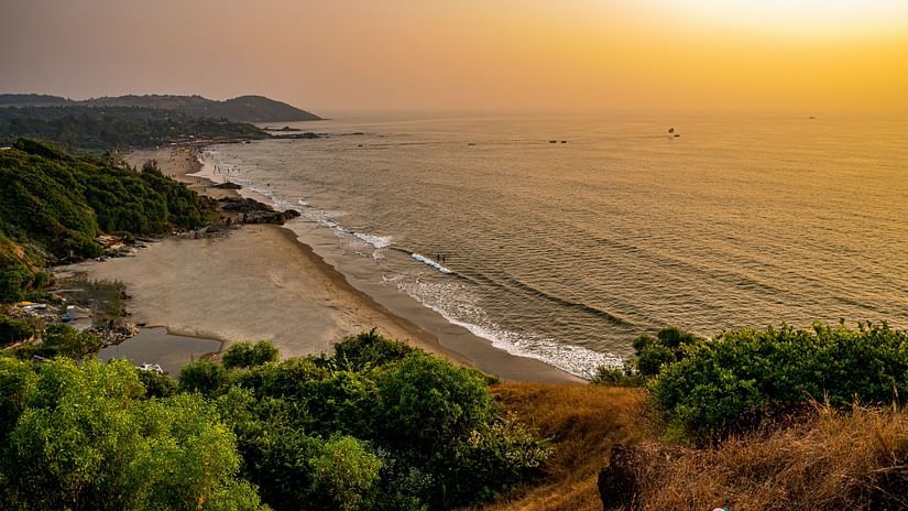 An aerial view of vagator beach during sunrise