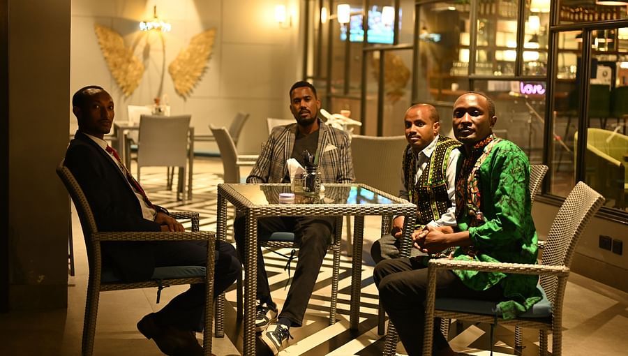 people at a restaurant table posing for a photo - Hotel Polo Towers, Agartala