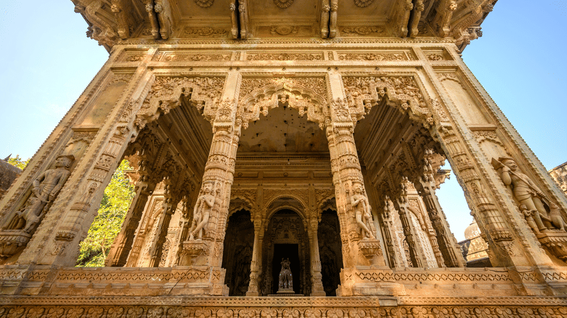 Deo Bagh - 17th Century, Gwalior - view of an entrance of brown coloured temple with designs carved on its facade