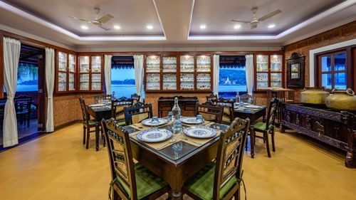 Wooden seating arrangements in Sea House Resturant Neemrana s Three waters