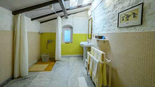 A Bathroom with towel hanger and a separate shower space - Ramgarh Bungalows, Nainital.