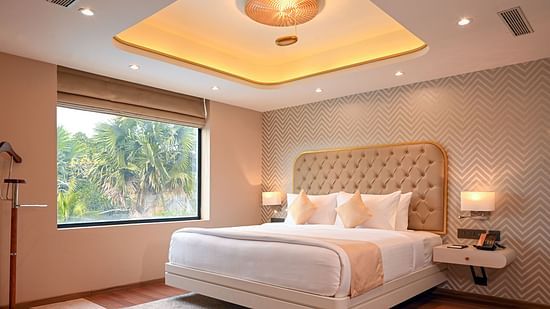 the bed at Superior Rooms in Kozhikode