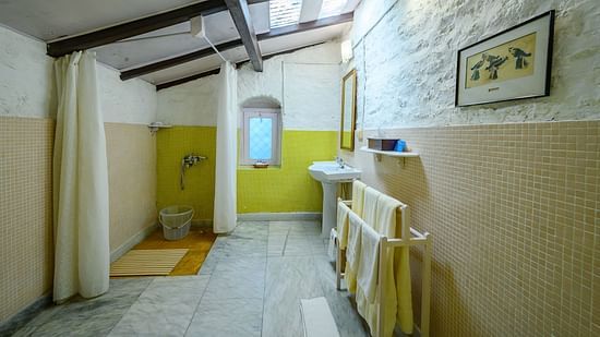 The Ramgarh Bungalows - a Bathroom with towel hanger and a separate shower space