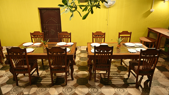 Dining table at Zestful Bites Restaurant in McCluskieganj