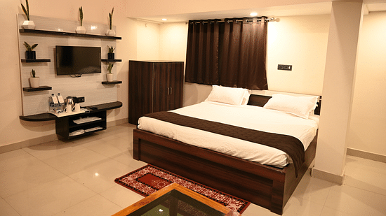 Safari Rooms in McCluskieganj with a cosy bed, a TV and more at Zeromile by Wedlock Greens