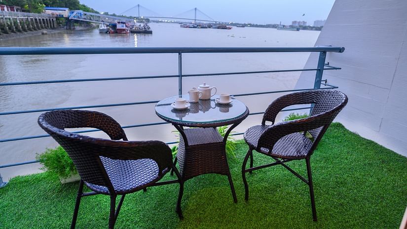 Two chairs and a table in the balcony of floatel