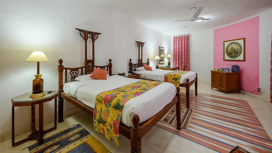 Hill Fort-Kesroli 14th Century Alwar - View of the Rawal Mahal room with twin beds and a lamp on either side