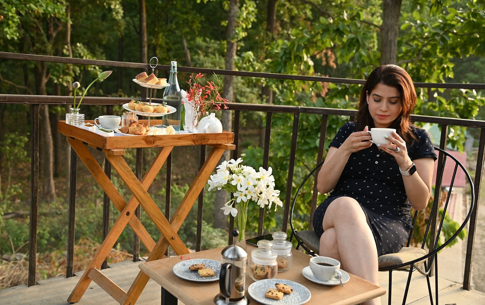 a woman enjoying tea at Saraca Corbett