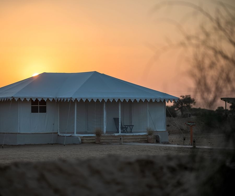 alt-text  The view of the cottage at sunset - Karwaan Jaisalmer