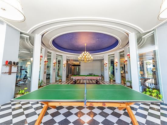 A table tennis table in a room with beautiful tiles - The Manor Luxury Hotels, Shimla