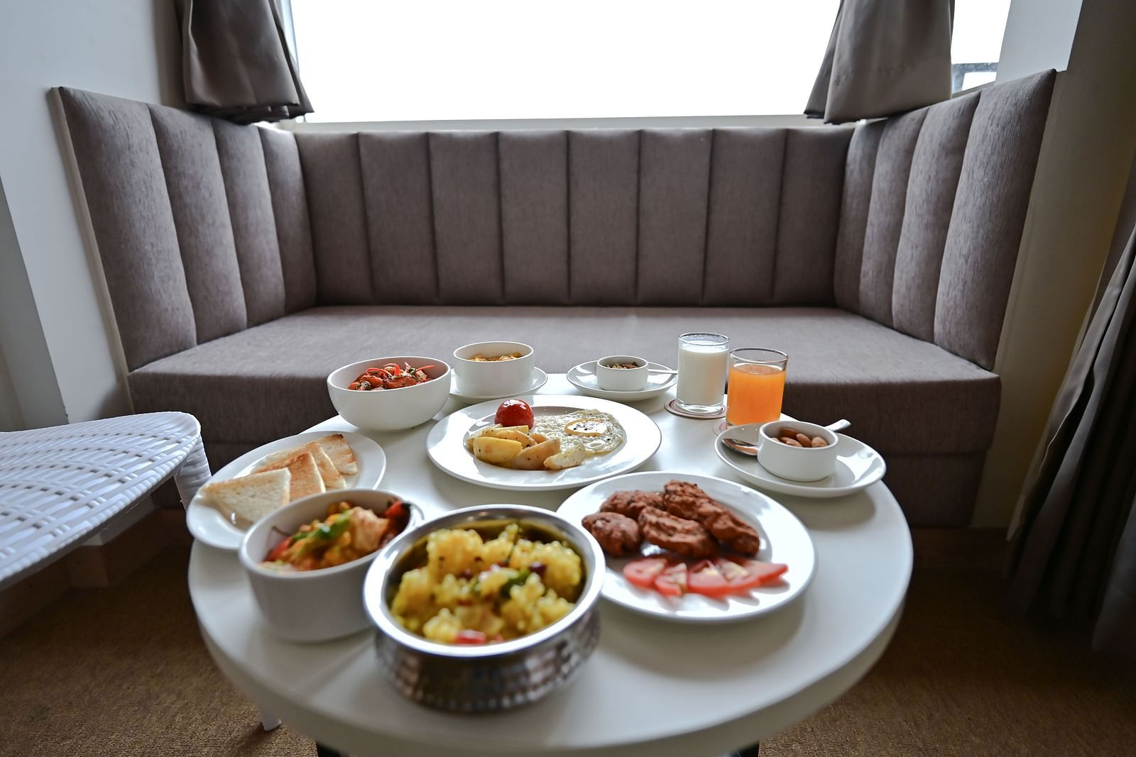 Image of a dining space with a platter of food at The Soma Hotel by Avianna Group, Darjeeling