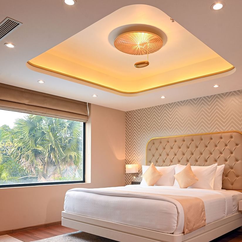 the bed at Superior Rooms in Kozhikode