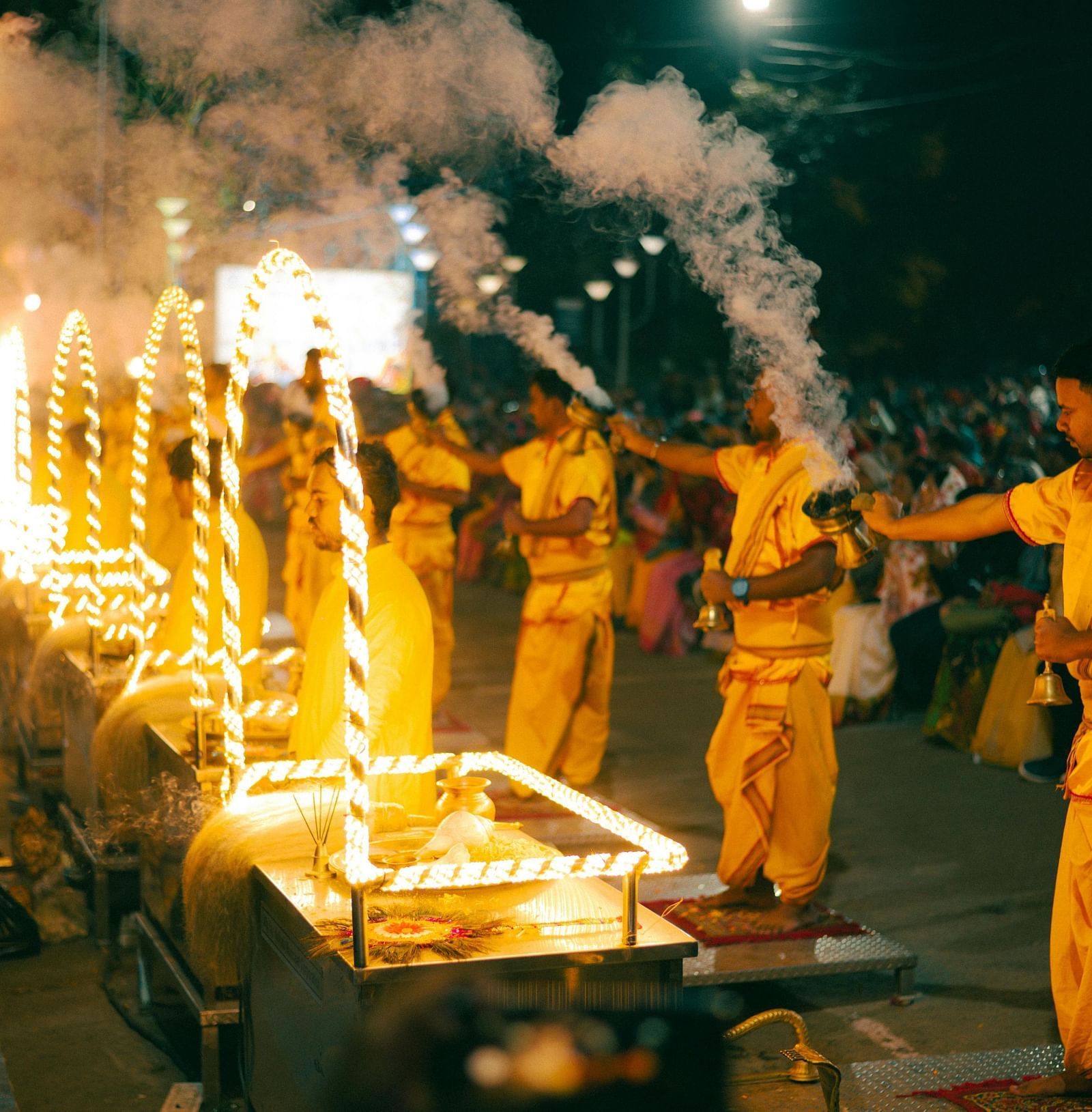 An image of evening prayer with priest holding incense in their hands