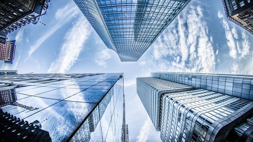 low-angle-photo-of-four-high-rise-curtain-wall-buildings-830891