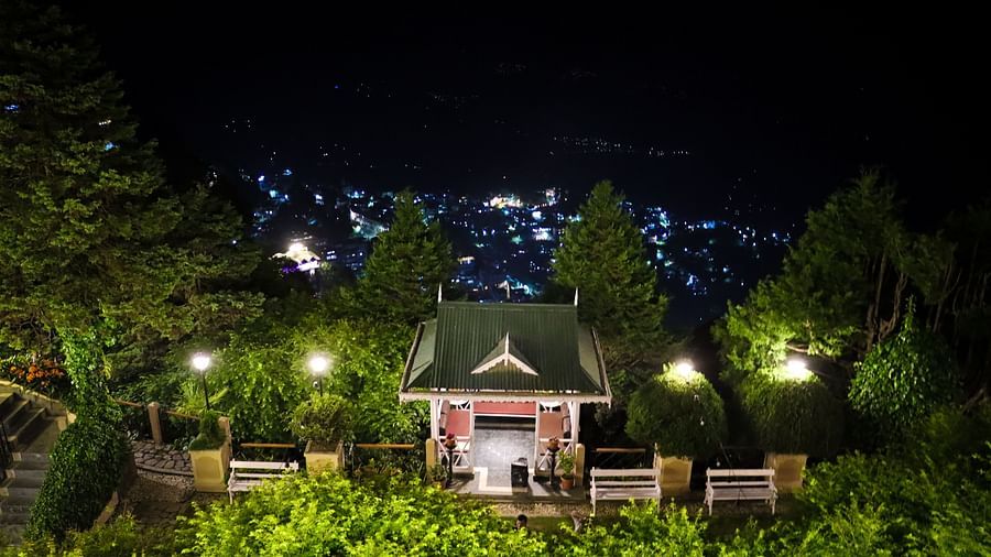 Nighttime garden view with gazebo at Cedar Inn