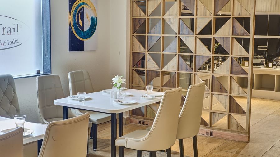 A close up shot of a dining table with well arranged cutlery and new glassware on it at the Moti Mahal Restaurant at Ilara Hotels & Spa, Tada.
