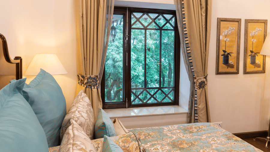 image of the window view from the bed of the Deluxe Room at The Claridges Nabha Residence