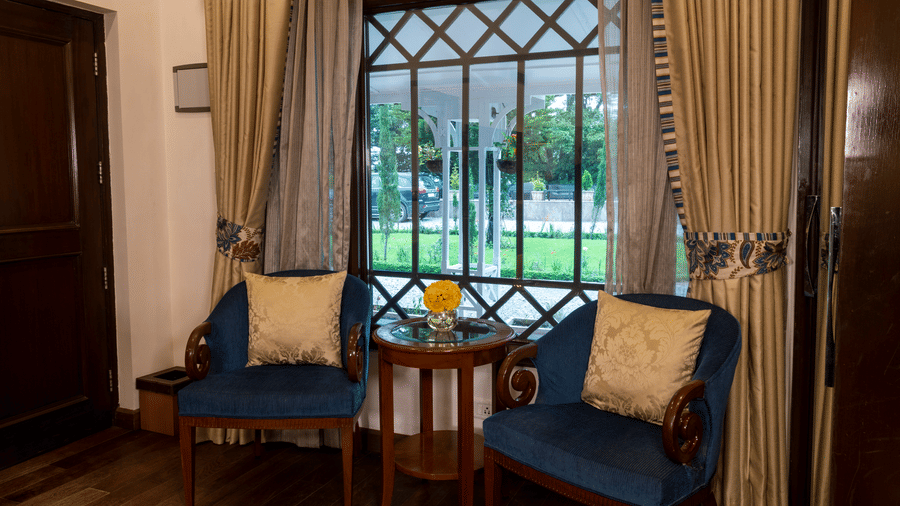 image of the seating area of the Deluxe Room at The Claridges Nabha Residence