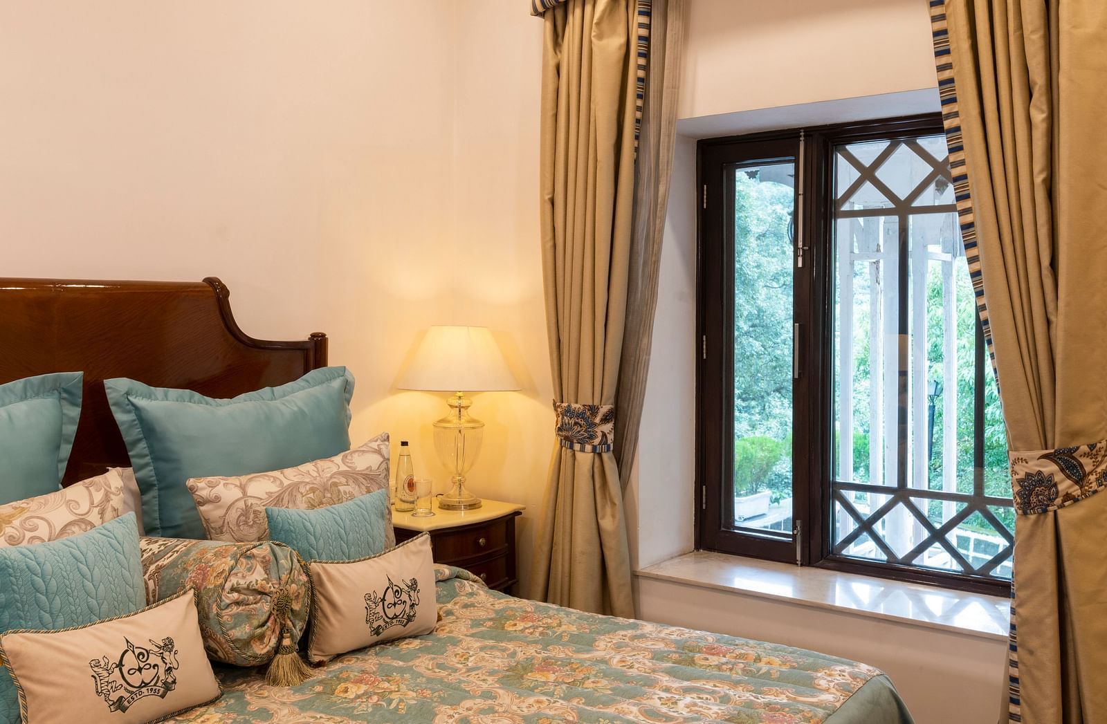 image of the window at the bed side of the Deluxe Room at The Claridges Nabha Residence