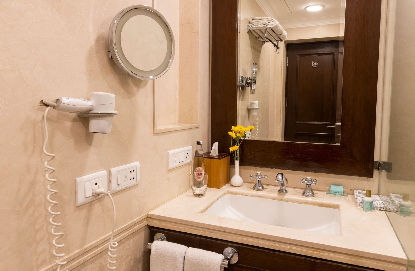 image of the bathroom with a sink and bathroom amenities at The Claridges Nabha Residence