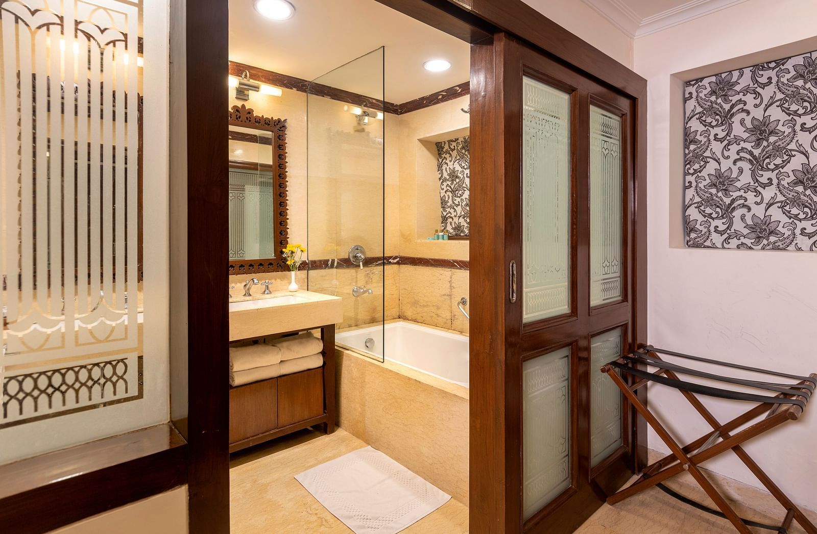view of the bathroom from its entrance with a bathtub at Club rooms at The Claridges Nabha Residence