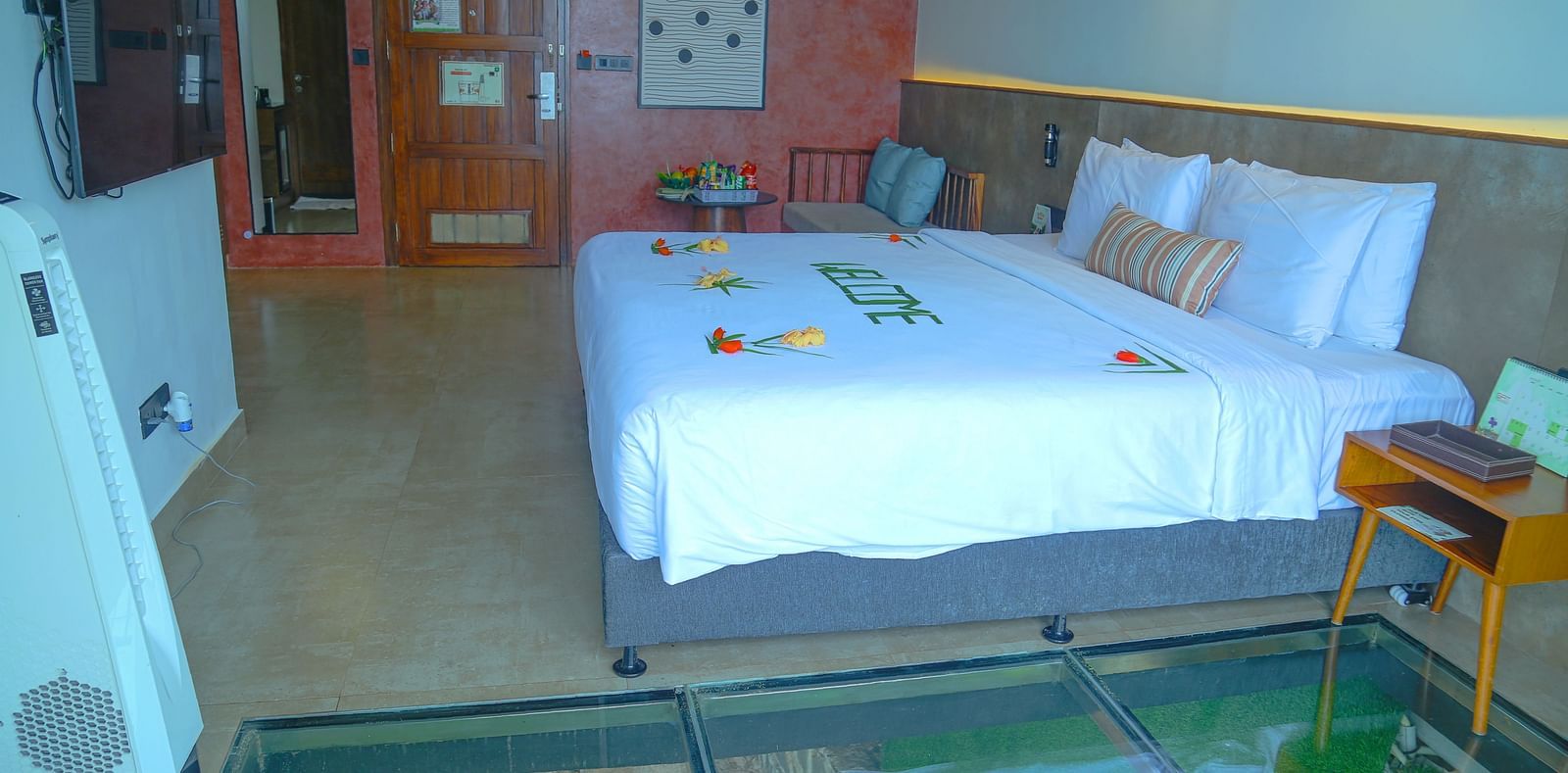 An image of the panorama view room with a king size bed, bed side table, wardrobe, and other modern amenities - Great Trails Yercaud by GRT Hotels