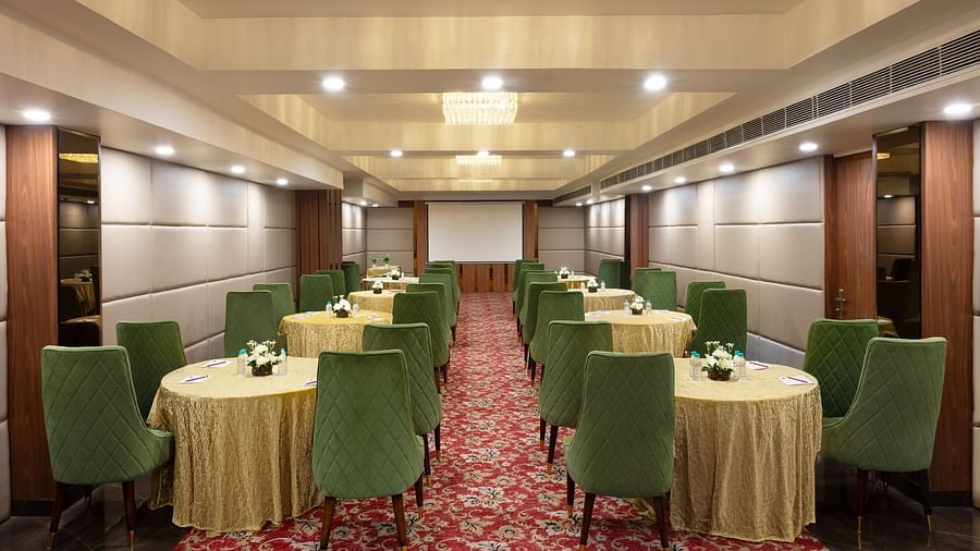  A banquet hall arranged with round tables and chairs, perfect for hosting events, conferences, or large gatherings - Clarks Inn Express, Near Jammu Bari Brahmana Railway Station