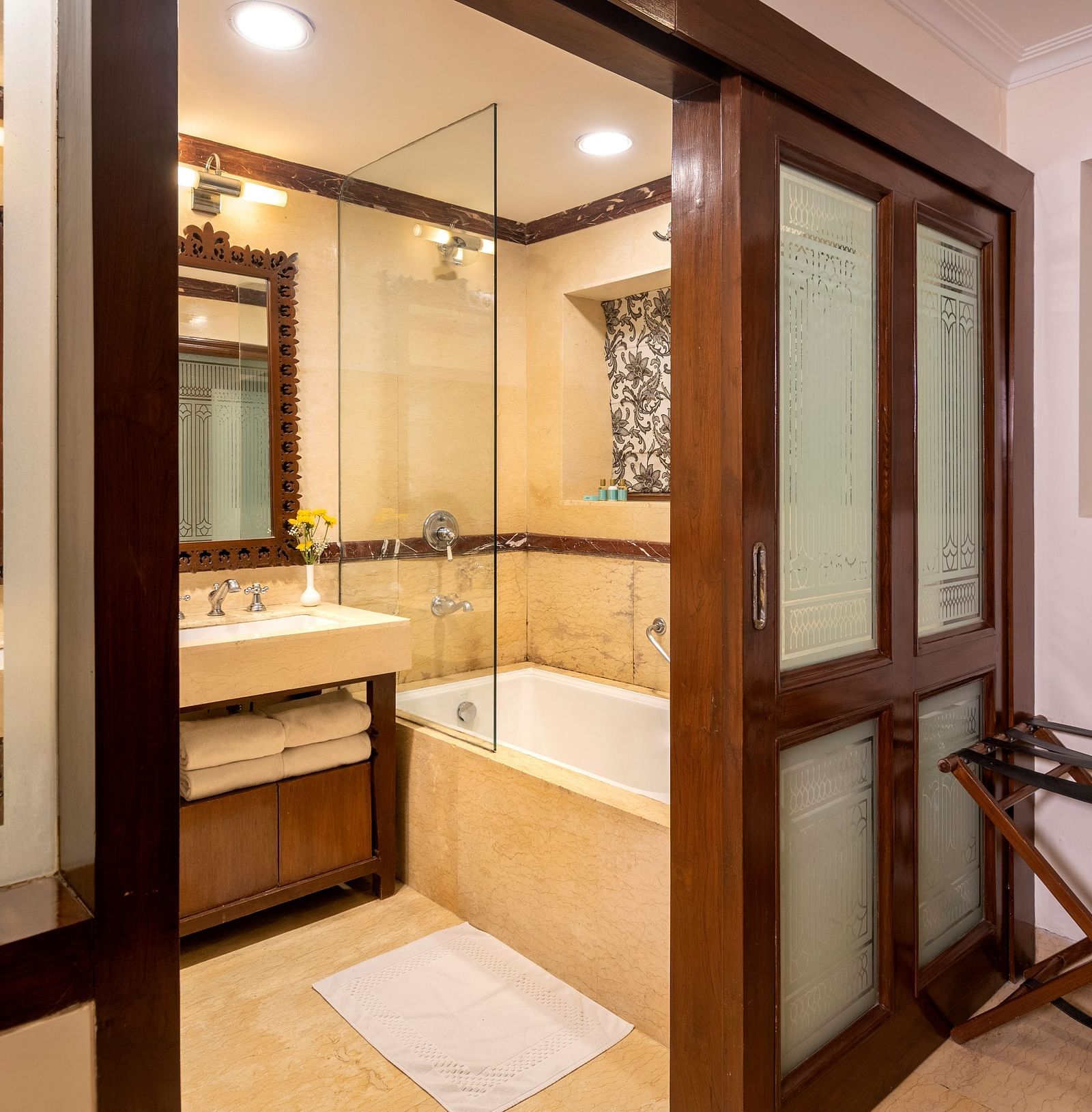view of the bathroom from its entrance with a bathtub at Club rooms at The Claridges Nabha Residence