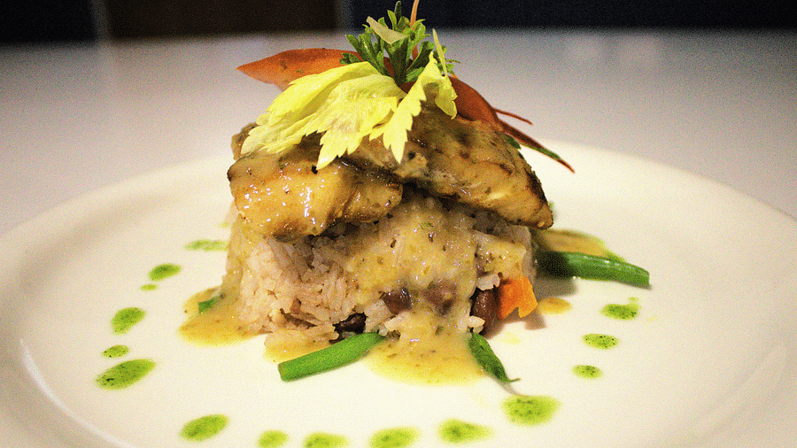 Layered gourmet dish with fresh greens and artistic sauce drizzle - Hotel 39, Jamaica