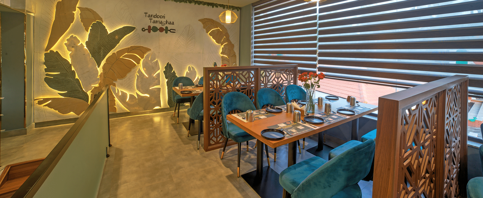 Bright dining space with contemporary design and green accents at Ilara Hotels & Spa, OMR, Chennai