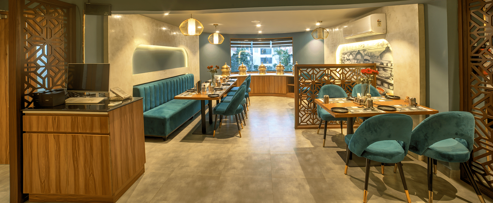Contemporary restaurant entrance with open seating and soft lighting at Ilara Hotels & Spa, OMR, Chennai