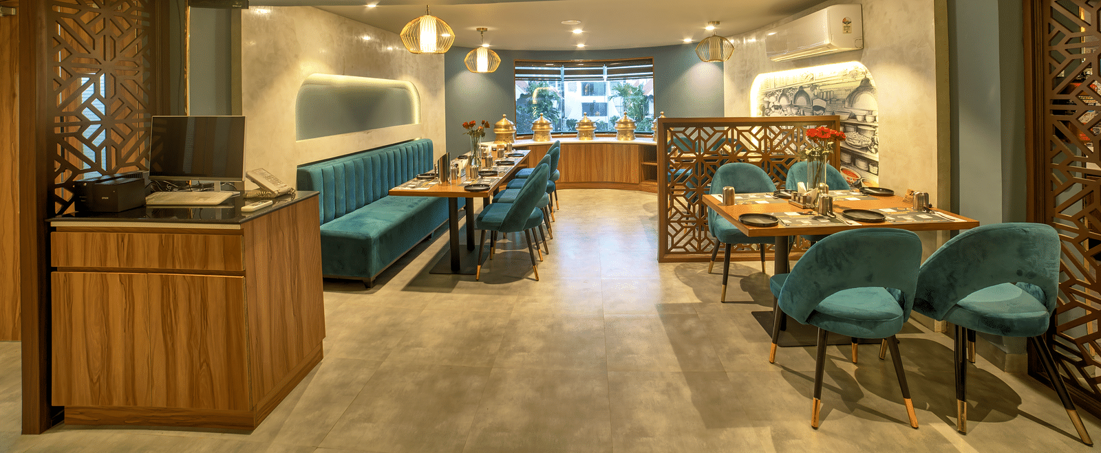 Contemporary restaurant entrance with open seating and soft lighting at Ilara Hotels & Spa, OMR, Chennai