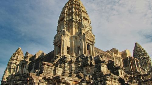a lower angle shot of an old temple shot during the day with ancient architecture