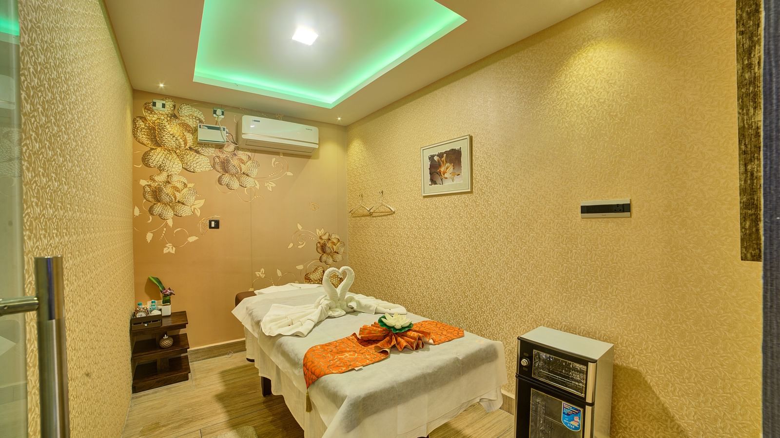 Corner view of a room featuring a spa table in the middle and a false ceiling above it at Ilara Hotels & Spa, Tada.