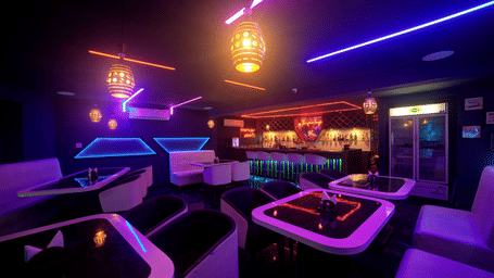 Lounge interior with glowing purple and blue lights and elegant white seating at Ilara Hotels & Spa, OMR, Chennai