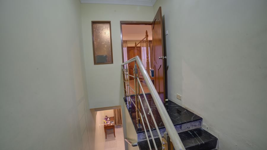 View of stairwell and corridor from the upper level of the hotel at Ilara Hotels & Spa, OMR, Chennai