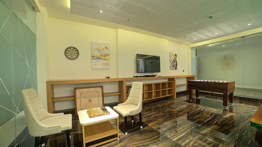 A Foosball table along with a chessboard at Ilara Hotels & Spa, Tada. 