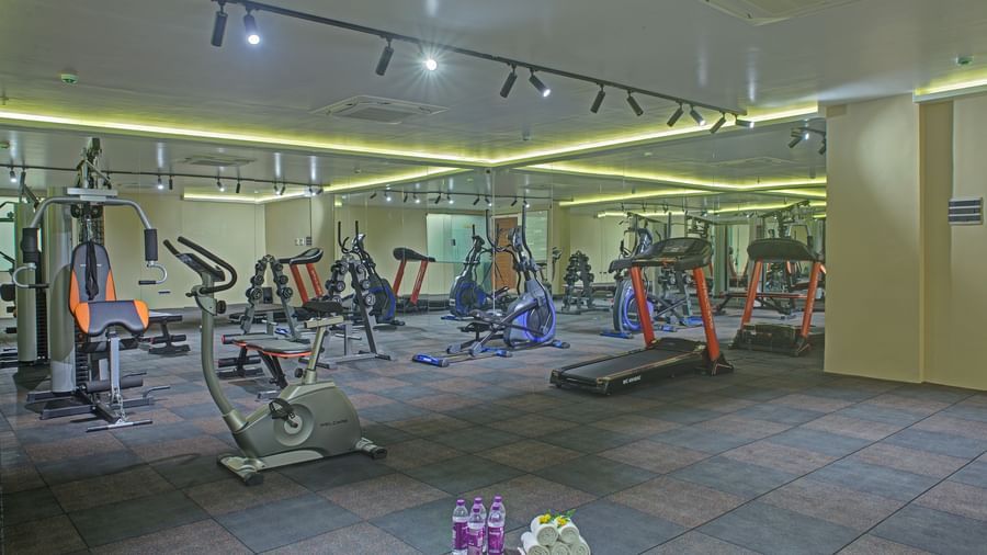Full view shot of a spacious gymnasium with padded flooring at Ilara Hotels & Spa, Tada.