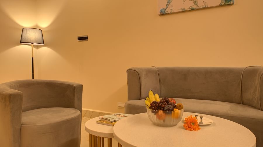 A close up shot of the coffee table in the living room of the Executive Suite with a fruit bowl at Ilara Hotels & Spa, Tada.