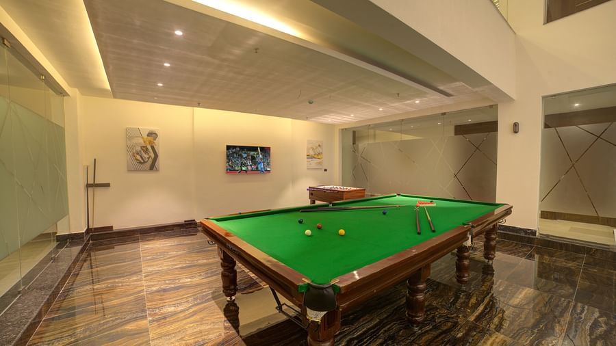 Full view shot of the indoor gaming area featuring a billiard table in the room at Ilara Hotels & Spa, Tada.