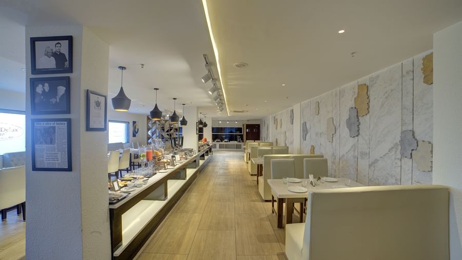 A pathway between the buffet counter and the dining tables at the Moti Mahal restaurant at Ilara Hotels & Spa, Tada.