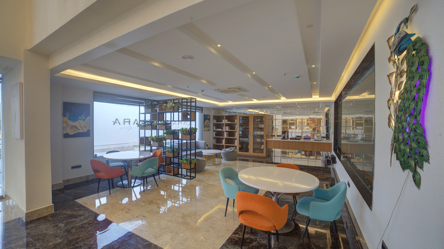 Full-view shot of the lobby at Ilara Hotels & Spa, Tada with a common seating area. 