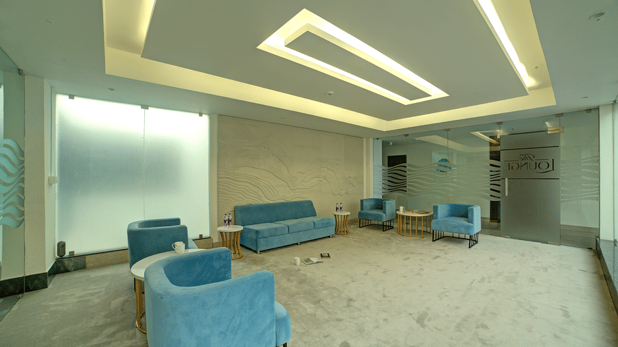 Full-view shot of the lounge area with comfortable seating area with modern interiors at Ilara Hotels & Spa, Tada.