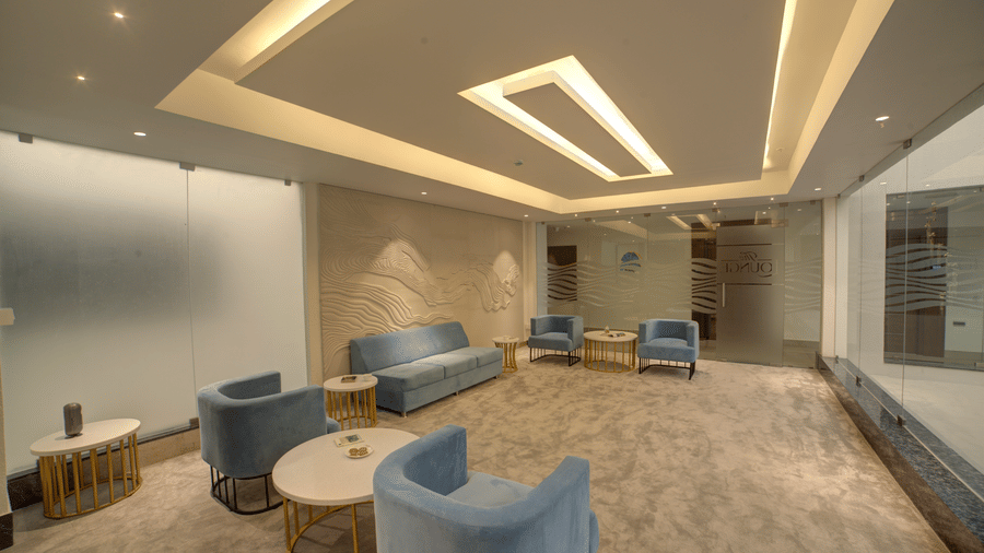 A wide-angle shot of the lounge with plush couches kept at some distance at Ilara Hotels & Spa, Tada.