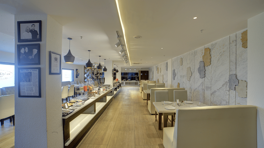 A pathway between the buffet counter and the dining tables at the Moti Mahal restaurant at Ilara Hotels & Spa, Tada.