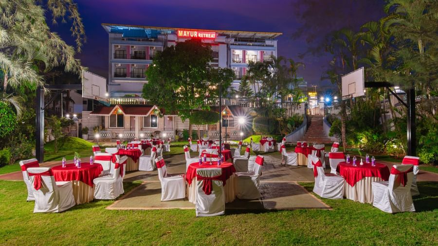 Lawn area with cluster seating arrangements for an event at Mayur Retreat.