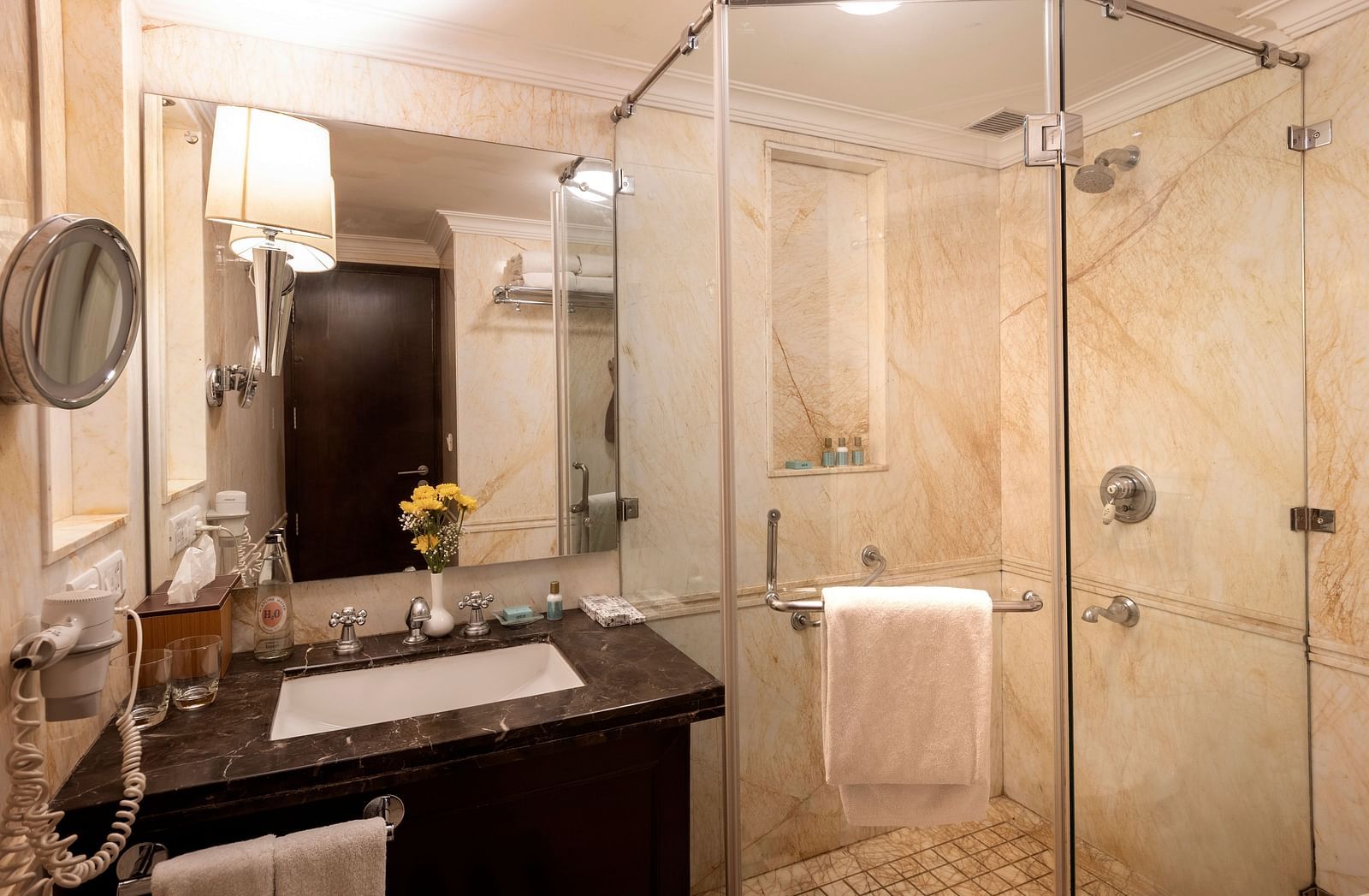 image of the bathroom with a sink and a cubical shower - The Claridges Nabha Residence
