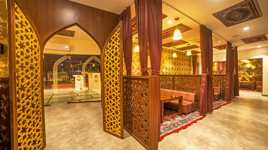 Royal-themed private dining area with intricate woodwork at Ilara Hotels & Spa, OMR, Chennai